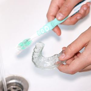 Sportsguard being brushed in sink