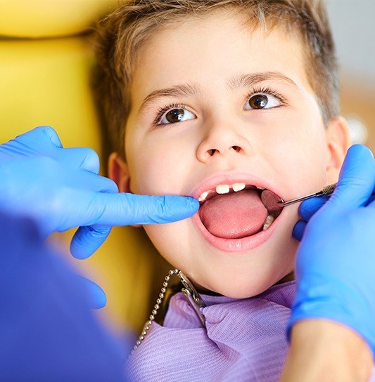 Young boy receiving dental checkup