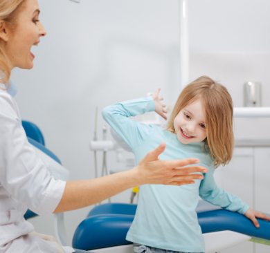 Little girl giving dentist a high five