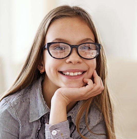 Preteen girl at dental checkup visit