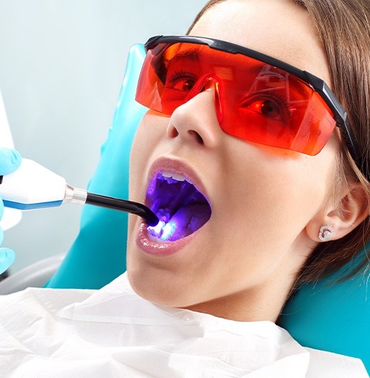 Young girl receiving dental sealants