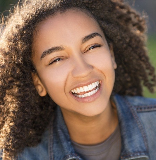 Preteen girl with metal free dental restorations