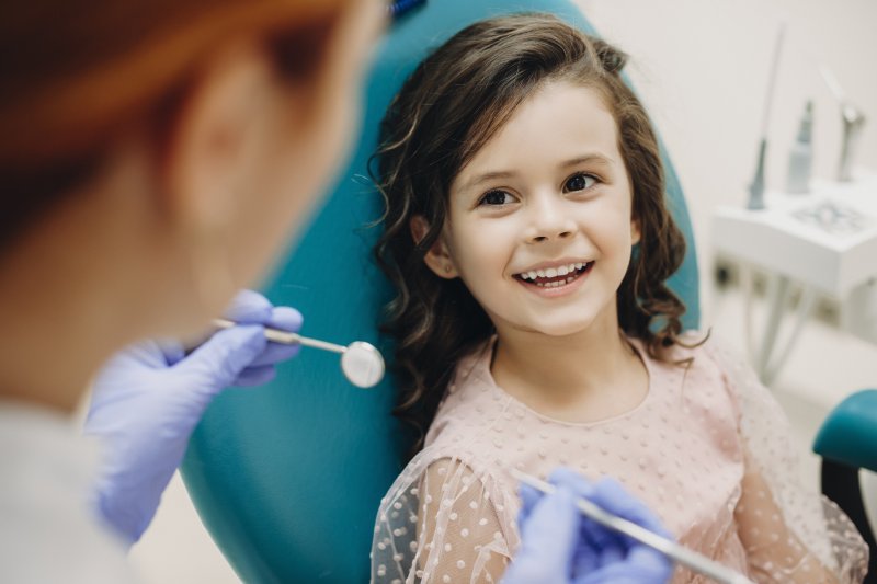young girl visiting pediatric dentist