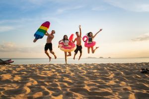 family playing on the beach