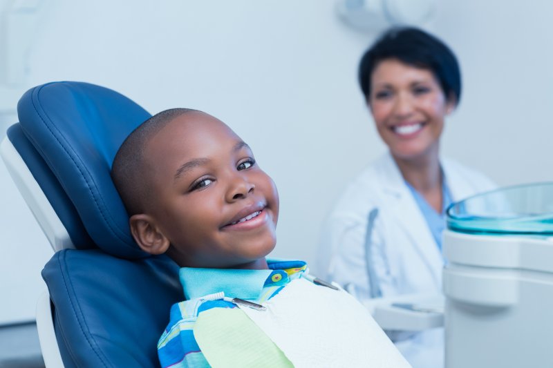 Child in the dental chair smiling with good oral health